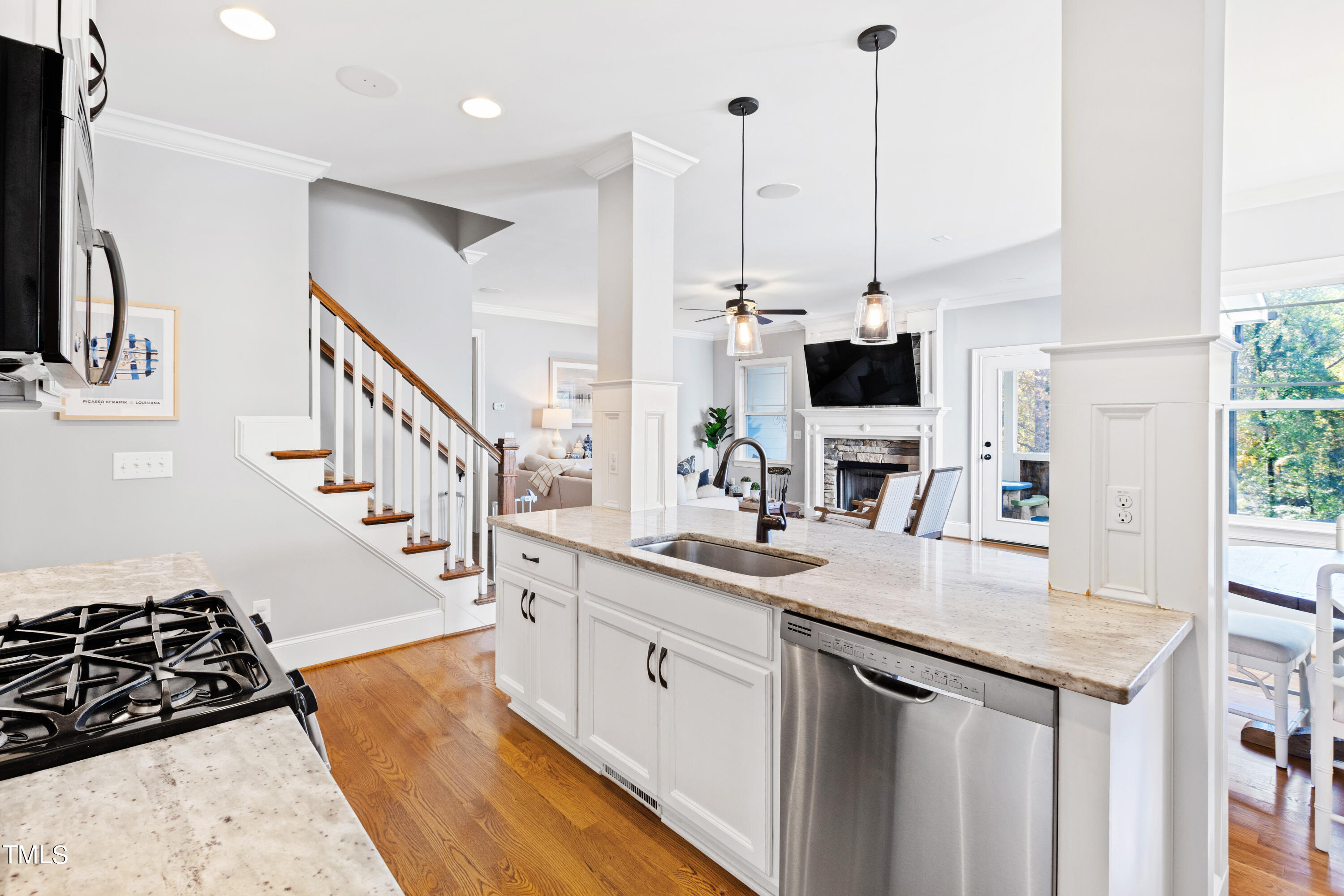 6213 Blanche Drive Raleigh, NC 27607 - Photo 10 of 48 a kitchen with stainless steel appliances granite countertop a sink a stove and a wooden floors