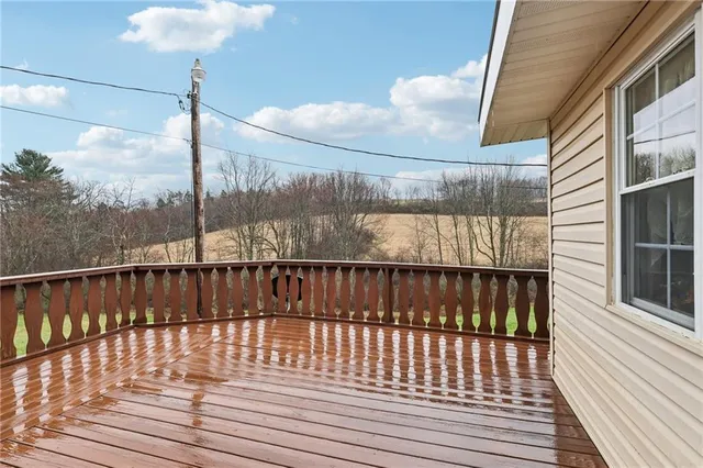 a view of balcony with wooden floor