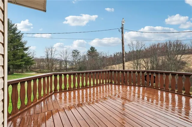 a view of balcony with wooden floor