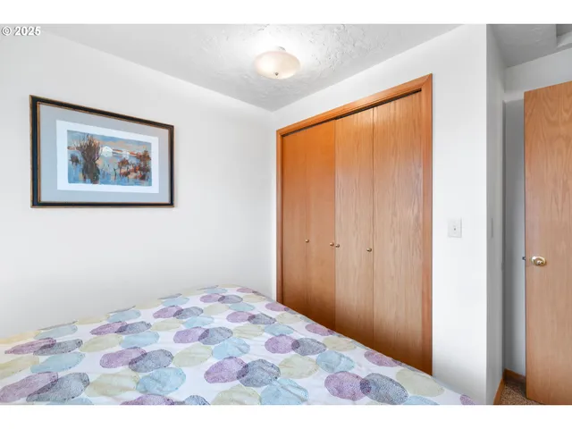 a kitchen with stainless steel appliances granite countertop a sink and a white cabinets