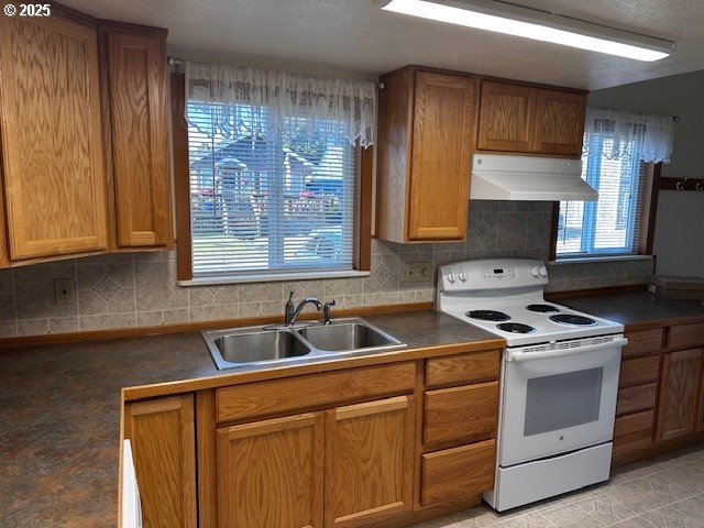 337 16th Avenue Seaside, OR 97138 - Photo 33 of 38 a kitchen with a sink stove and cabinets