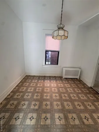 a view of an empty room and window