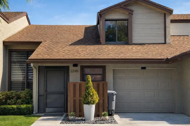 an empty room with large windows