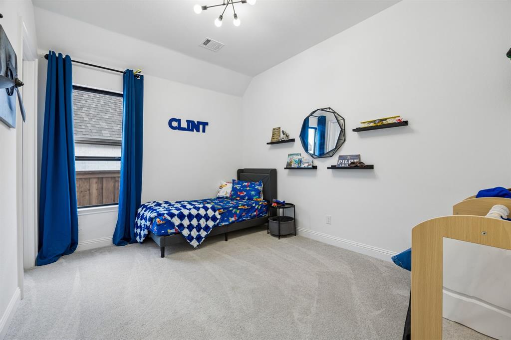 1717 Tolleson Drive Fort Worth, TX 76008 - Photo 24 of 40 a bedroom with furniture and window