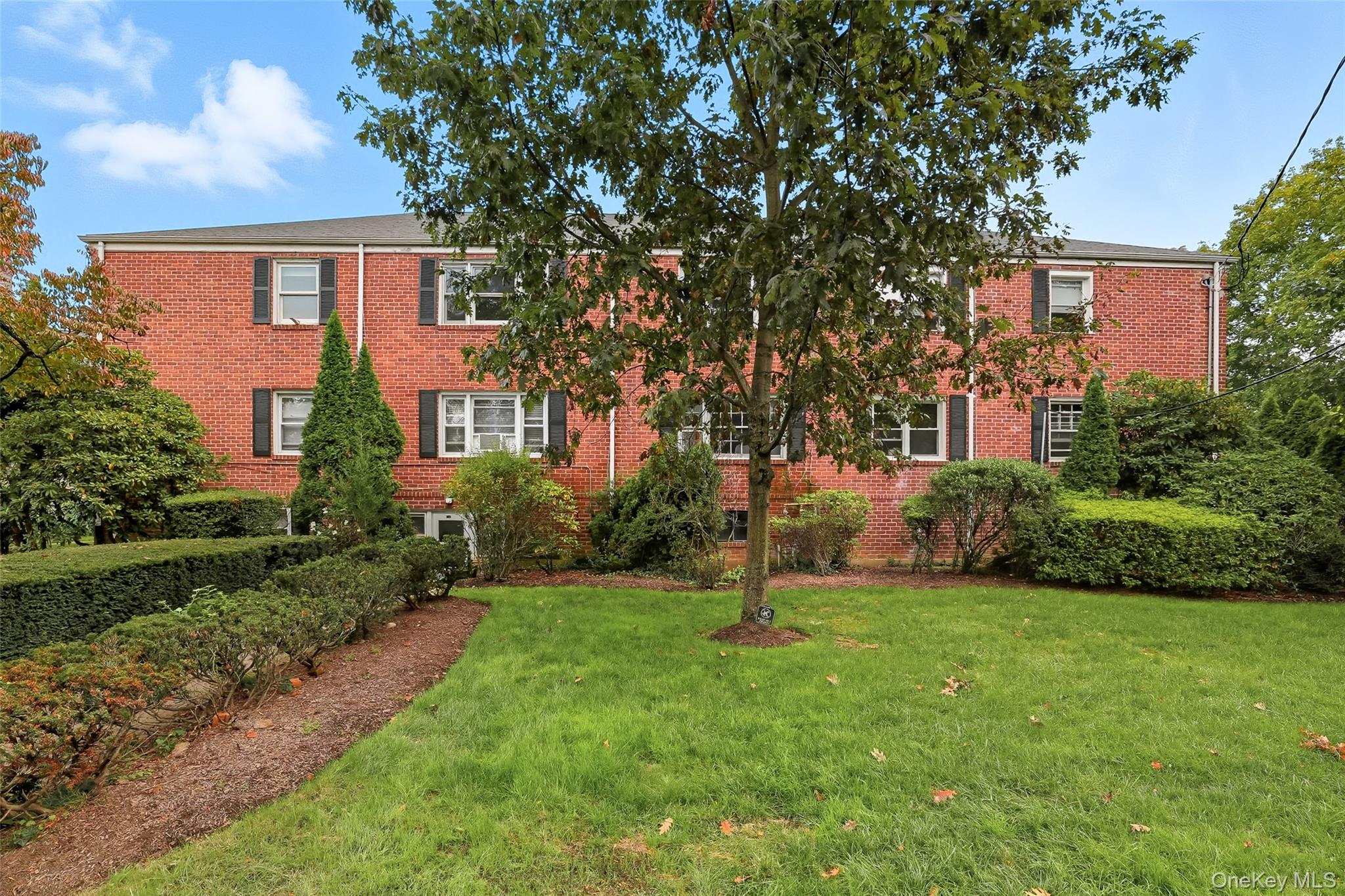15 Chestnut Street, Unit A4 Rye, NY 10580 - Photo 1 of 14 a view of a house with a backyard