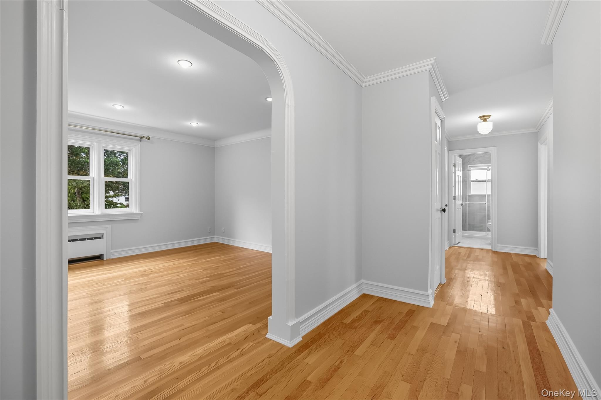 15 Chestnut Street, Unit A4 Rye, NY 10580 - Photo 3 of 14 a view of empty room with wooden floor and fan