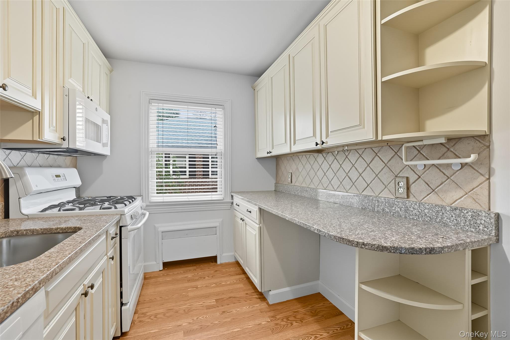15 Chestnut Street, Unit A4 Rye, NY 10580 - Photo 8 of 14 a kitchen with stainless steel appliances granite countertop a sink stove and cabinets