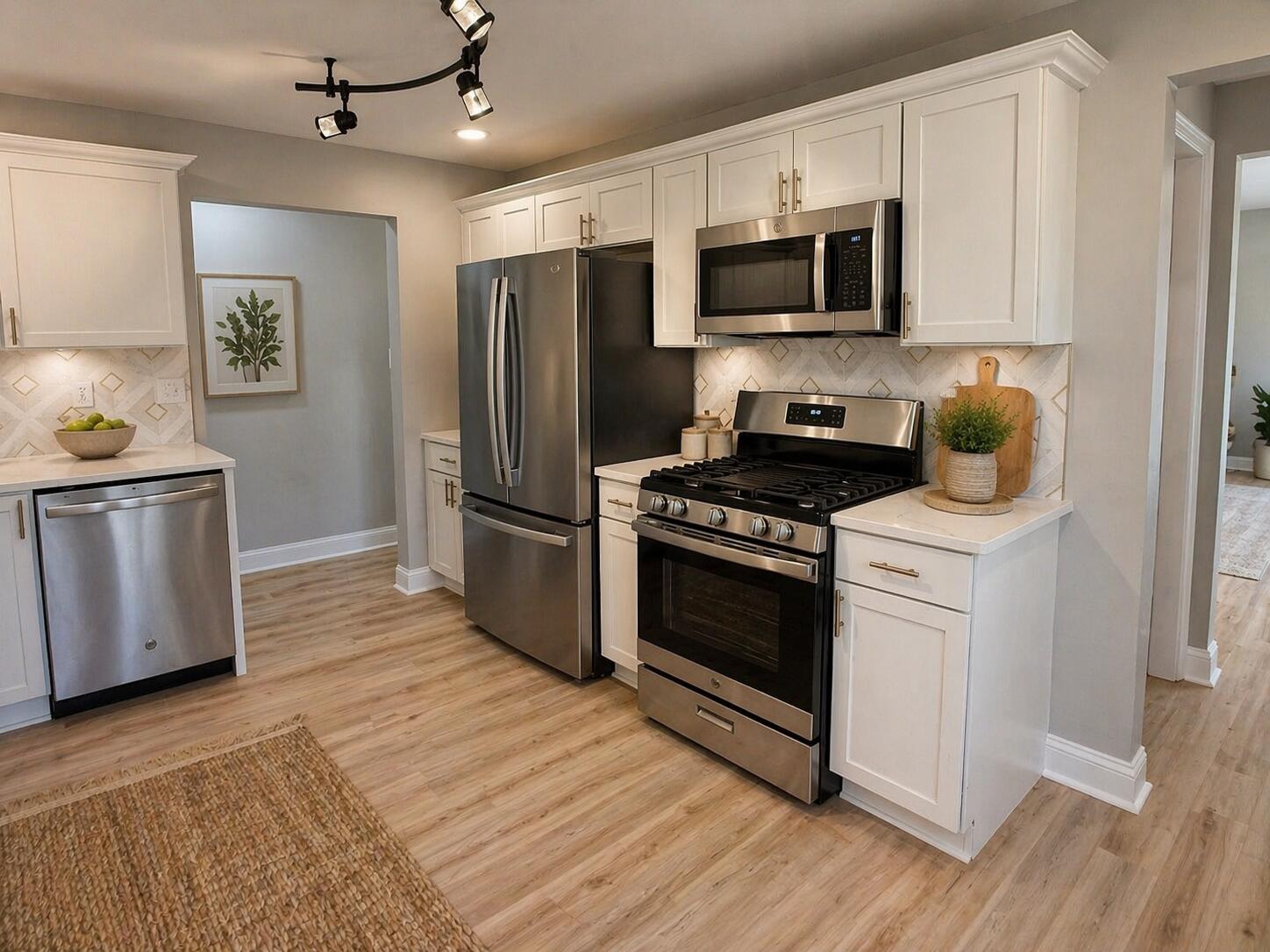 415 North Grand Boulevard Gary, IN 46403 - Photo 12 of 45 a kitchen with granite countertop a refrigerator stove and microwave