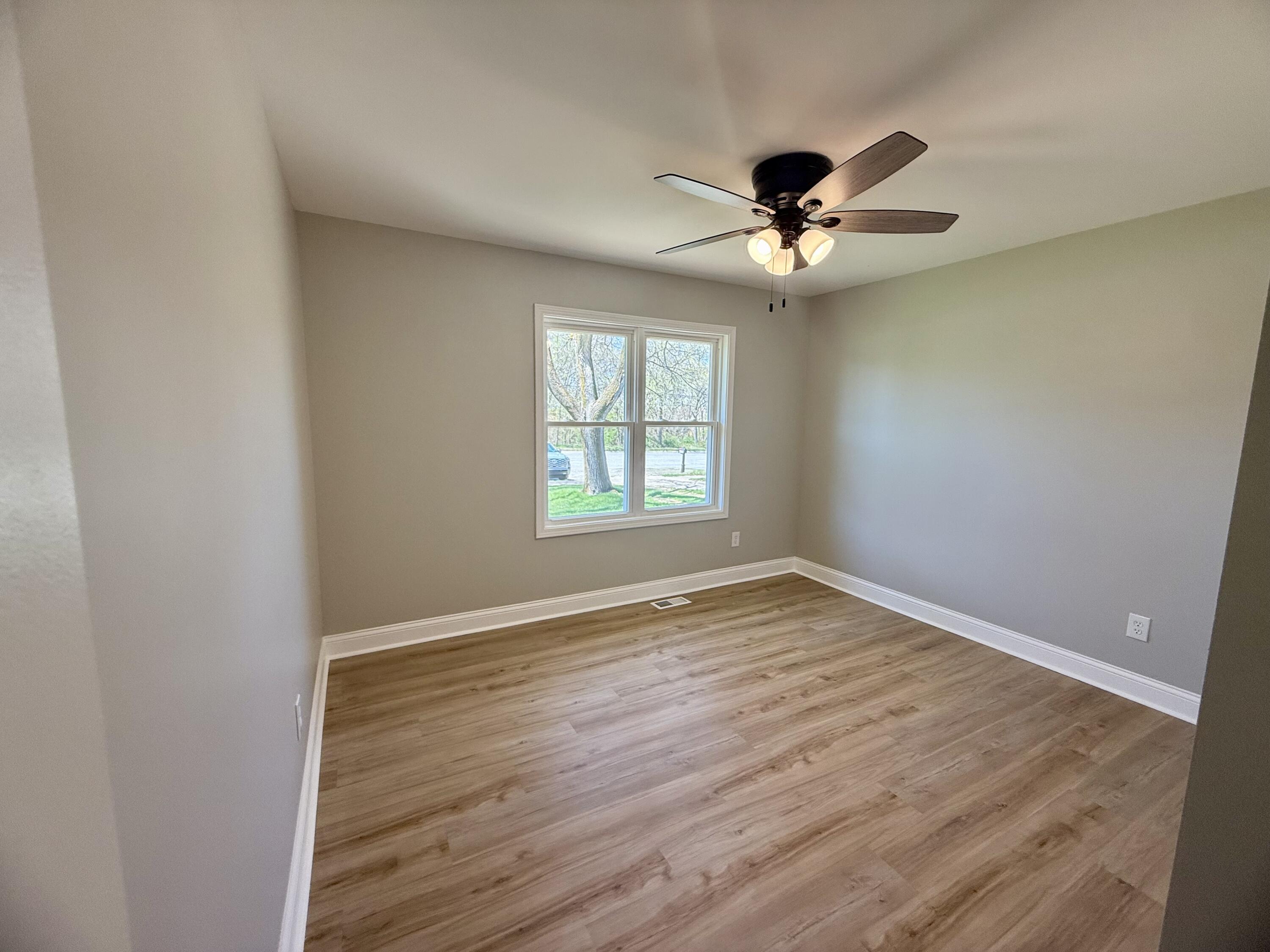 415 North Grand Boulevard Gary, IN 46403 - Photo 19 of 45 wooden floor in an empty room with a window