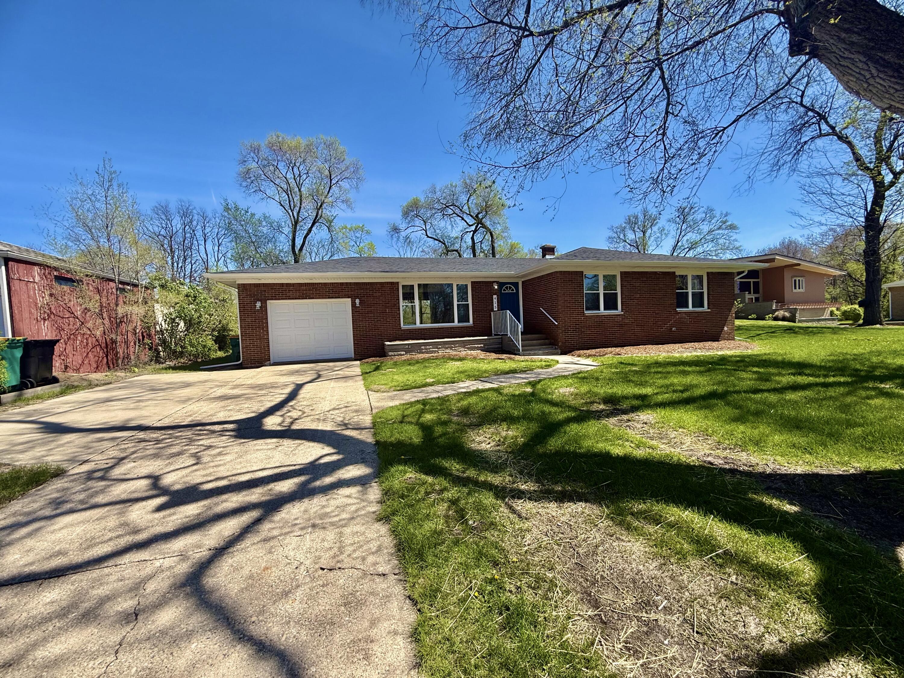 415 North Grand Boulevard Gary, IN 46403 - Photo 2 of 45 a view of a house with a yard