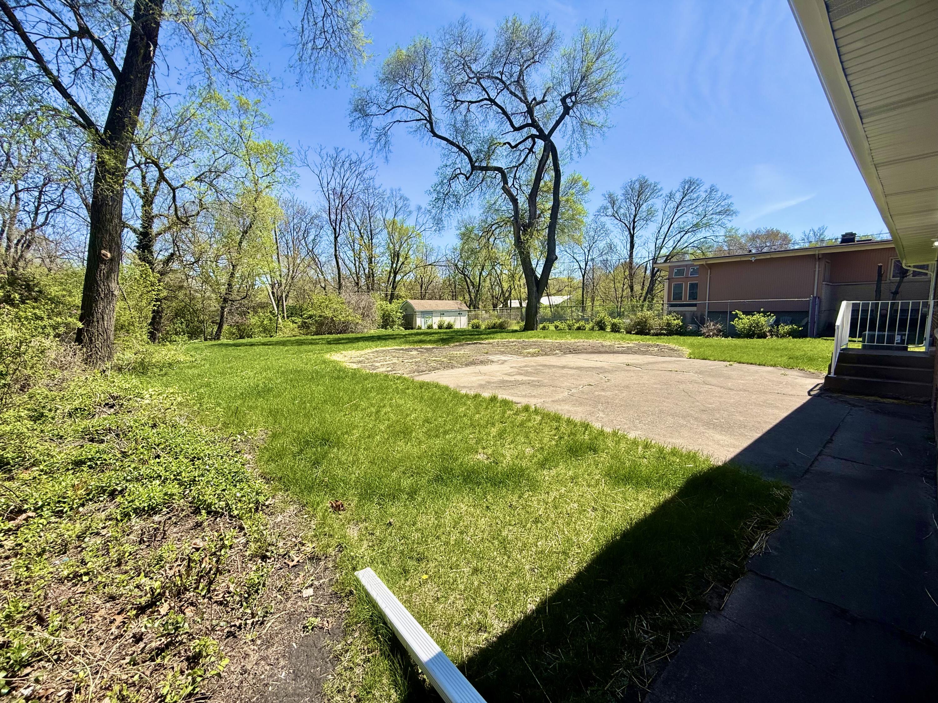 415 North Grand Boulevard Gary, IN 46403 - Photo 40 of 45 a view of a backyard with large trees