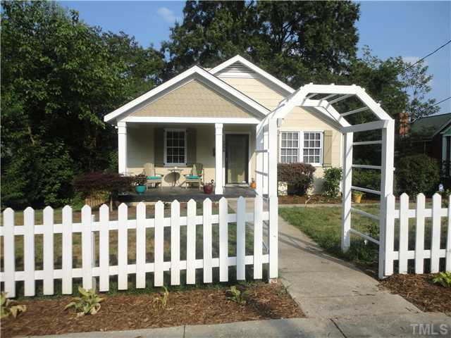 1206 Clifton Street Raleigh, NC 27604 - Photo 1 of 25 a front view of white house with a garden