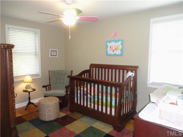1206 Clifton Street Raleigh, NC 27604 - Photo 15 of 25 a bedroom with furniture and a window