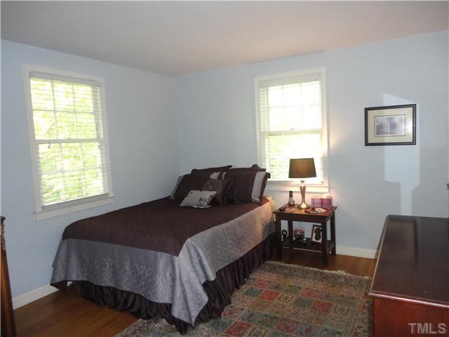 1206 Clifton Street Raleigh, NC 27604 - Photo 16 of 25 a bedroom with a bed and a window