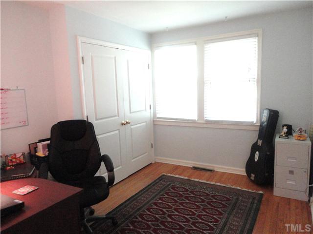 1206 Clifton Street Raleigh, NC 27604 - Photo 18 of 25 a view of room with window and wooden floor