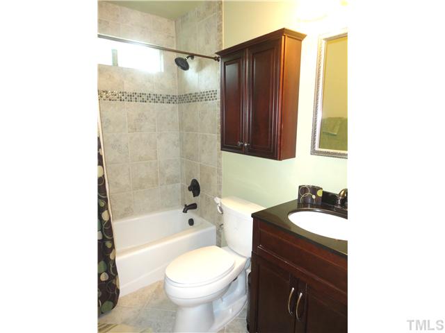1206 Clifton Street Raleigh, NC 27604 - Photo 19 of 25 a bathroom with a sink toilet and shower