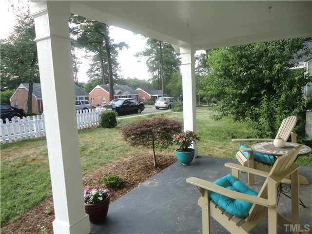 1206 Clifton Street Raleigh, NC 27604 - Photo 3 of 25 a view of a tables and chairs in back yard of the house