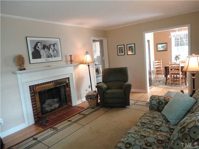 1206 Clifton Street Raleigh, NC 27604 - Photo 6 of 25 a living room with furniture and a fireplace