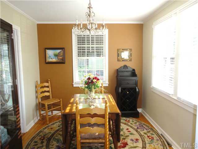 1206 Clifton Street Raleigh, NC 27604 - Photo 8 of 25 a view of a dining room with furniture and chandelier