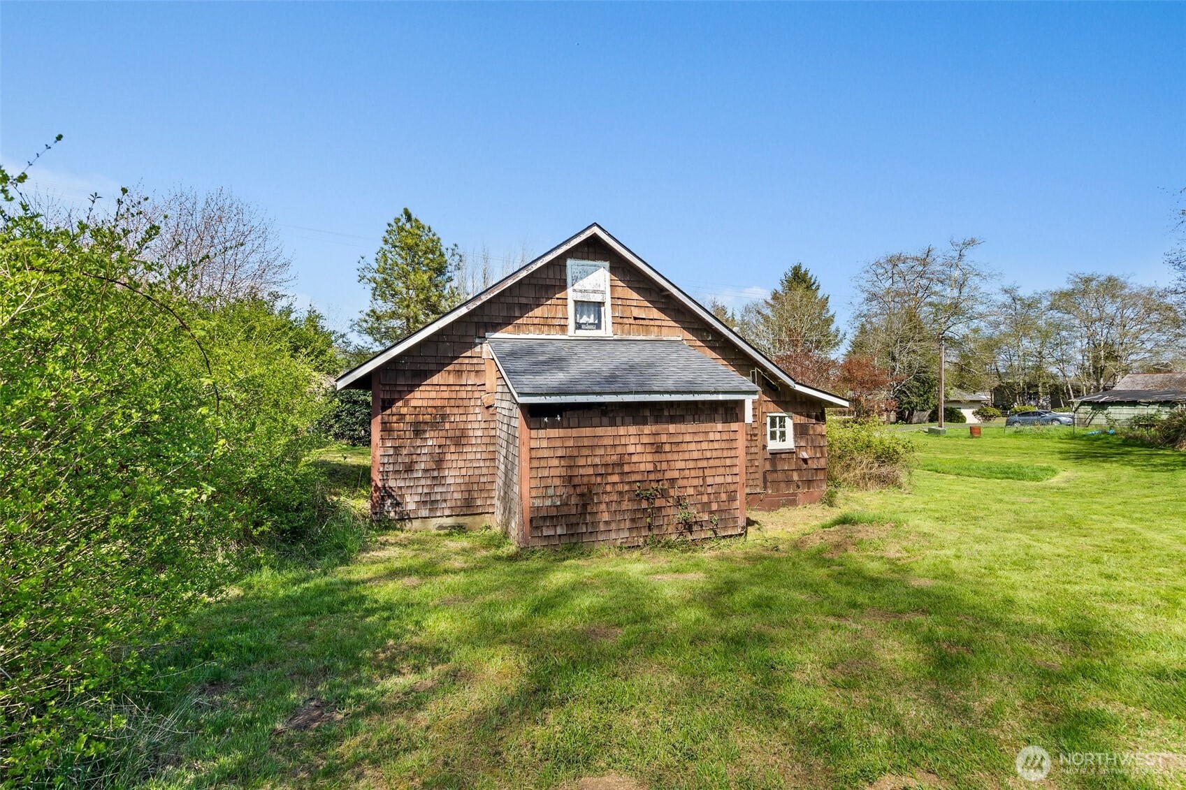 1234 Sherman Avenue Raymond, WA 98577 - Photo 5 of 8 a front view of a house with garden
