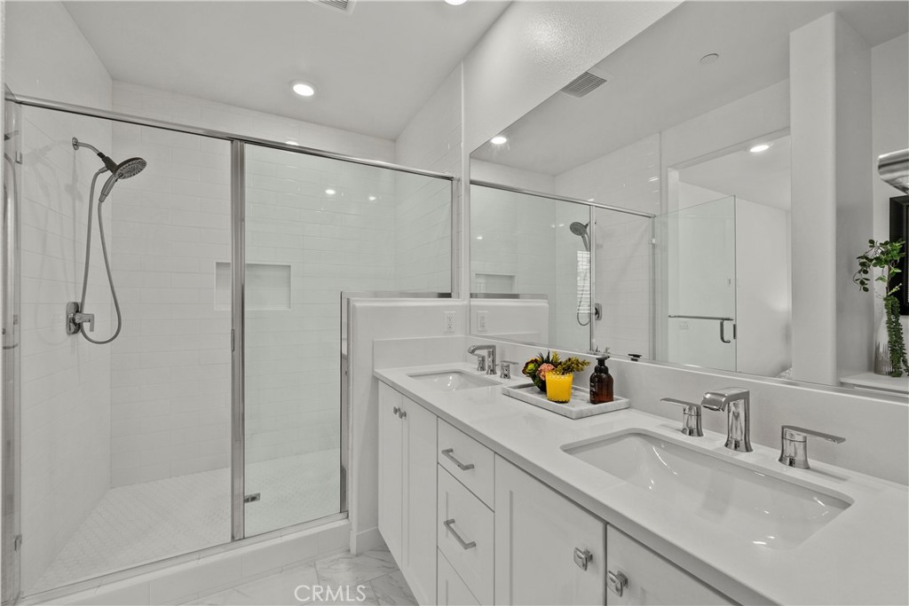 1663 Rosewell Road West Covina, CA 91791 - Photo 23 of 45 a bathroom with a sink double vanity and shower