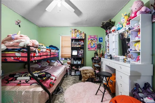 a bedroom with furniture and a bed