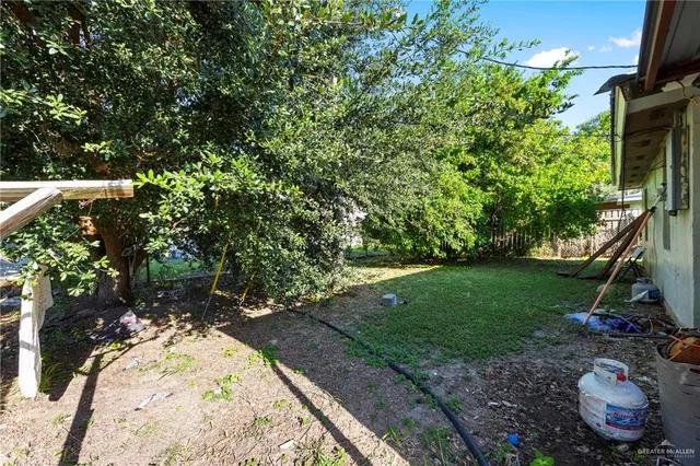 a backyard of a house with lots of green space