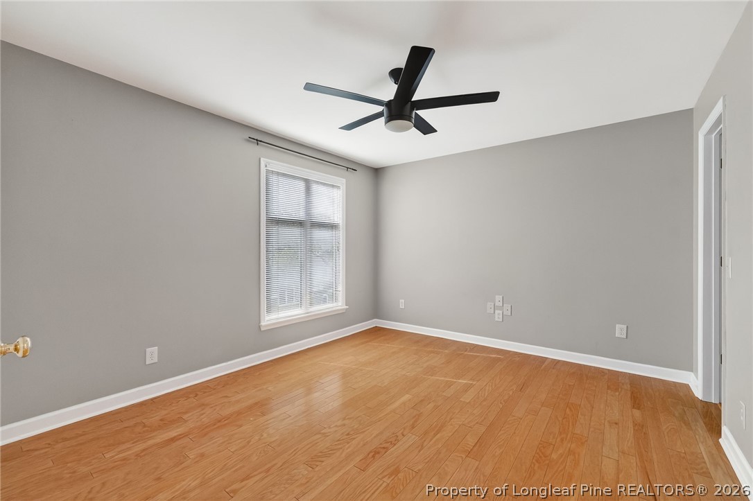 1221 Westview Lane, Unit 301 Raleigh, NC 27605 - Photo 15 of 32 a view of a big room with wooden floor closet and windows