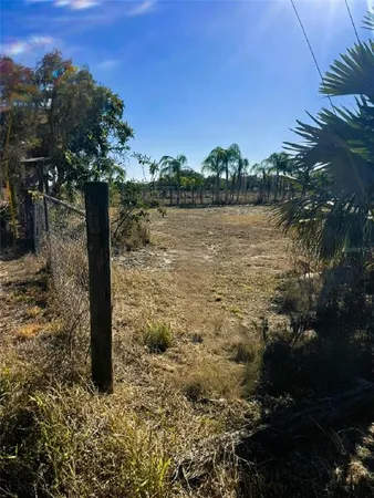 a view of a lake with a house in the background