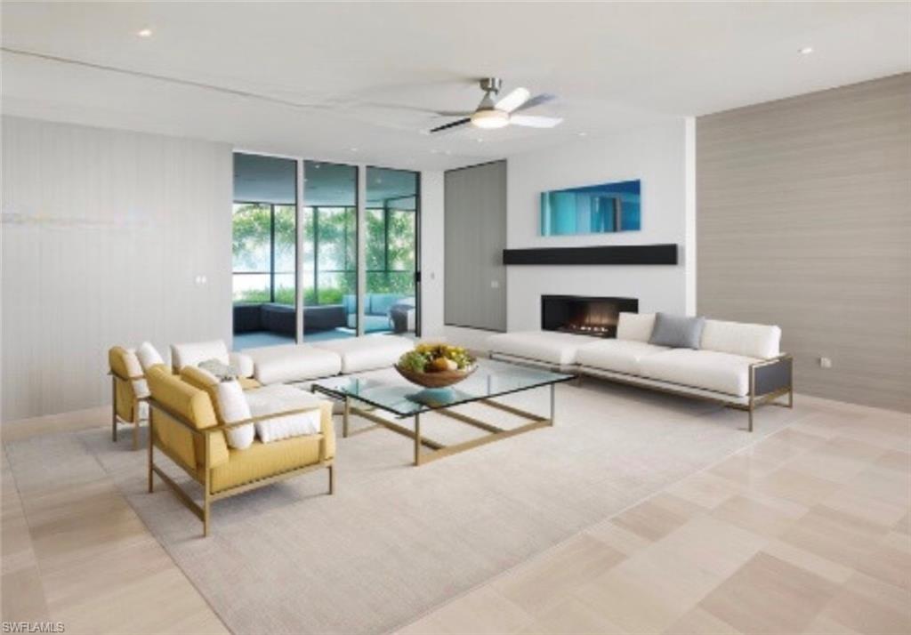 18355 Fuchsia Road Fort Myers, FL 33967 - Photo 4 of 13 a living room with furniture and a fireplace