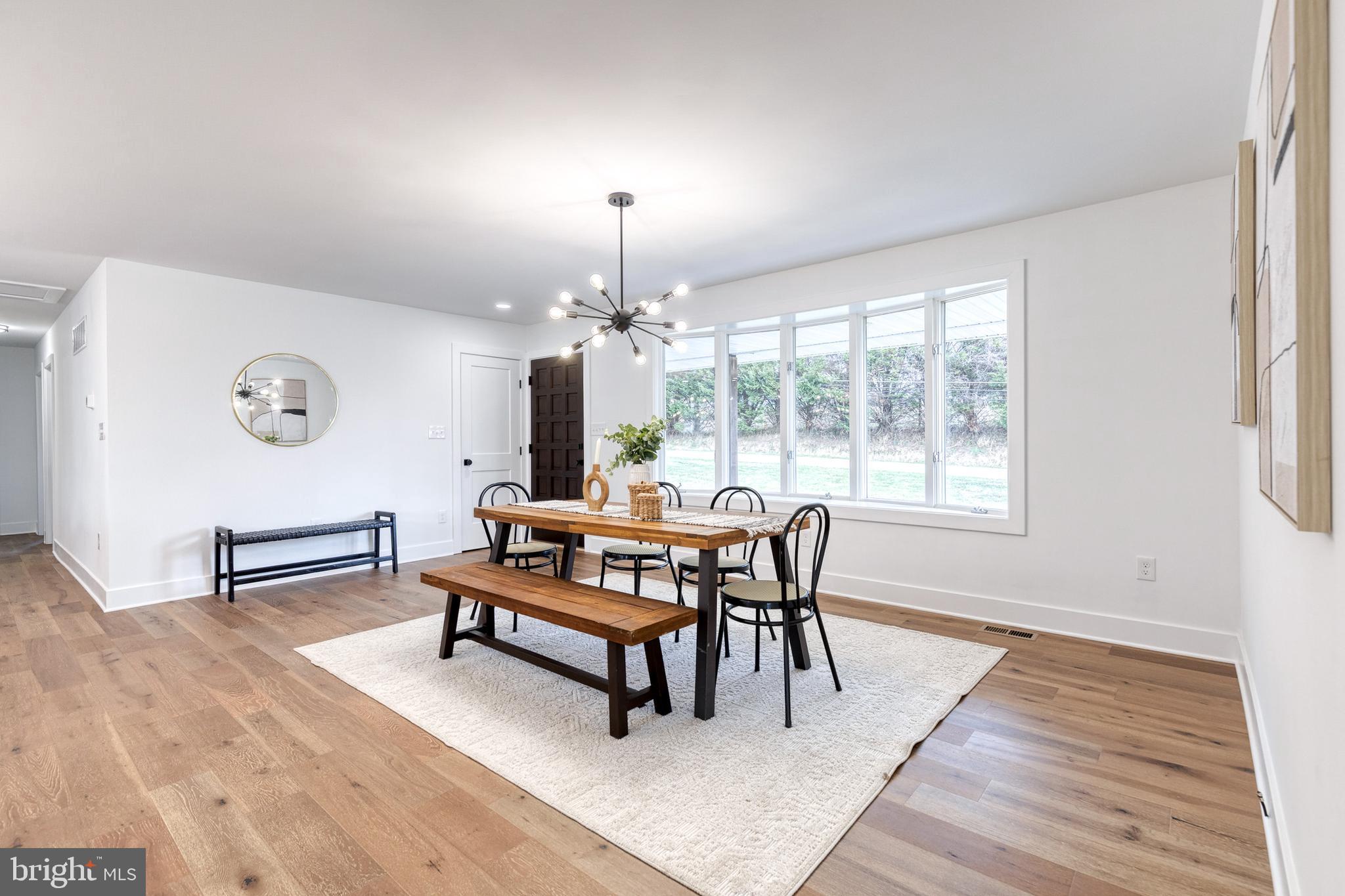 4011 Perry Hall Road Perry Hall, MD 21128 - Photo 15 of 51 a view of a dining room with furniture and chandelier