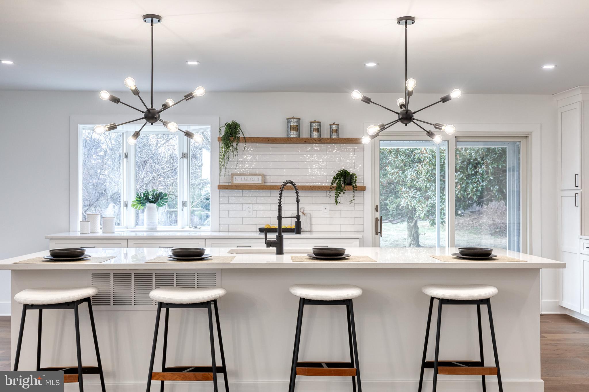 4011 Perry Hall Road Perry Hall, MD 21128 - Photo 25 of 51 a dining room with furniture a window and a chandelier