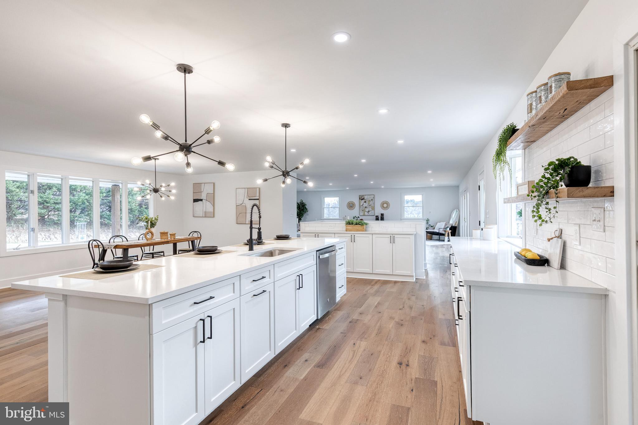 4011 Perry Hall Road Perry Hall, MD 21128 - Photo 30 of 51 a kitchen with counter top space a sink appliances and cabinets