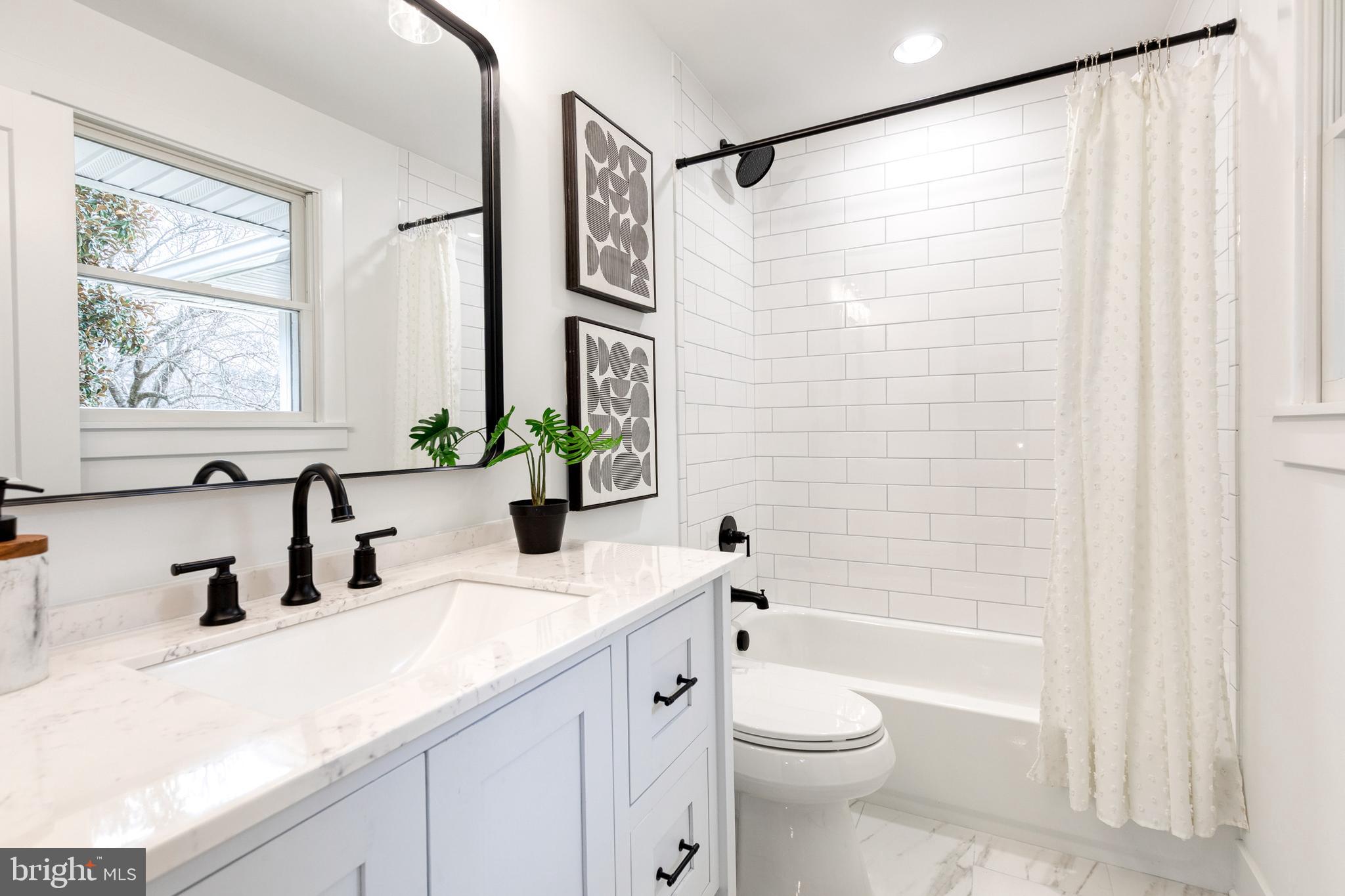 4011 Perry Hall Road Perry Hall, MD 21128 - Photo 35 of 51 a bathroom with a granite countertop sink toilet and shower