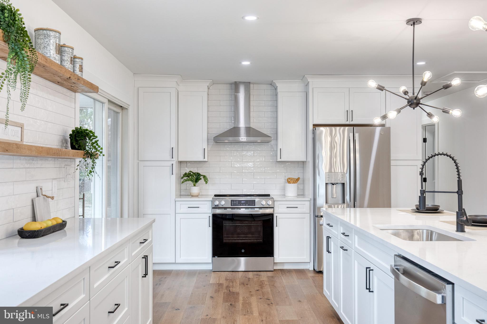 4011 Perry Hall Road Perry Hall, MD 21128 - Photo 6 of 51 a kitchen with stainless steel appliances granite countertop a stove a sink and a refrigerator