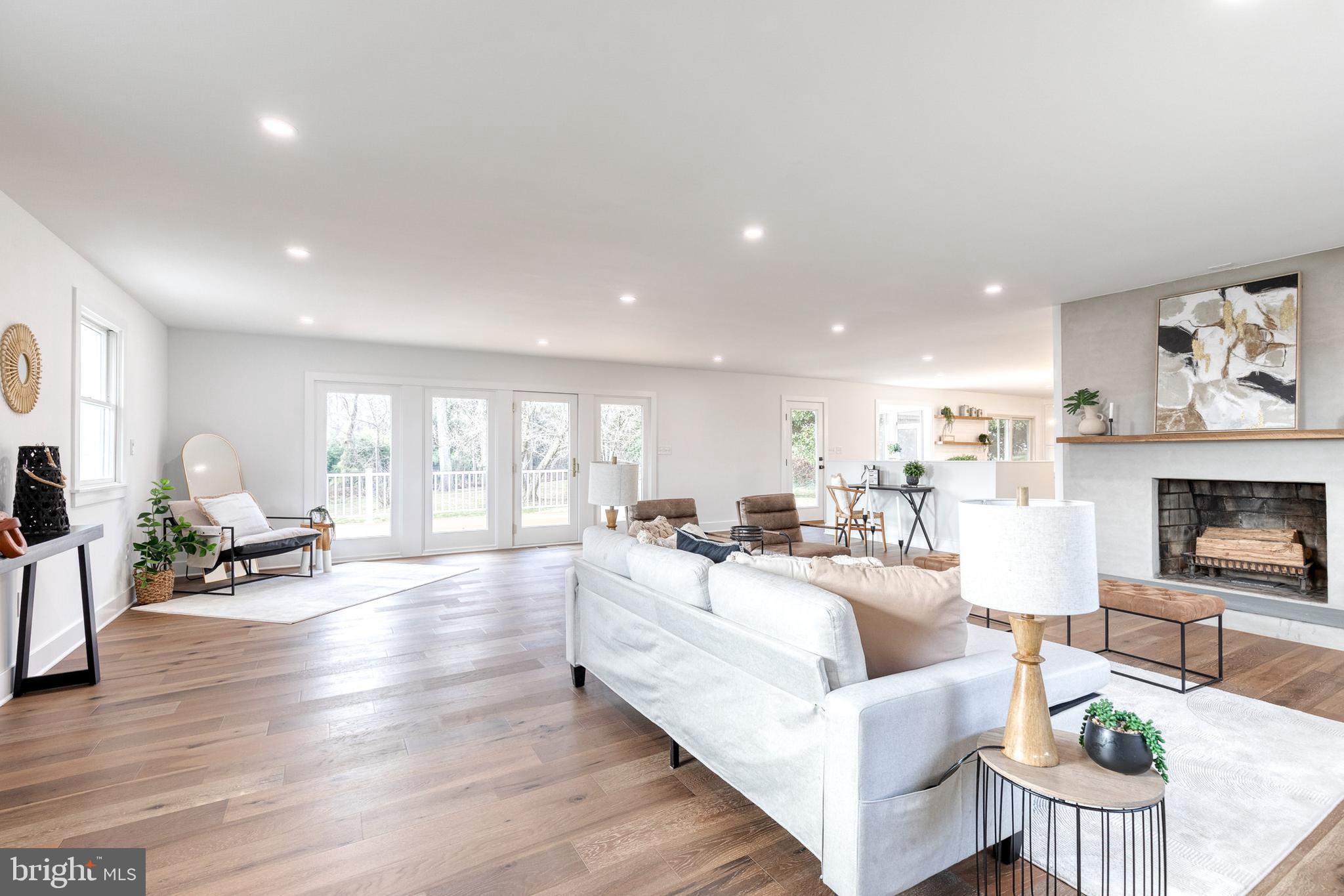 4011 Perry Hall Road Perry Hall, MD 21128 - Photo 8 of 51 a living room with fireplace furniture and a wooden floor