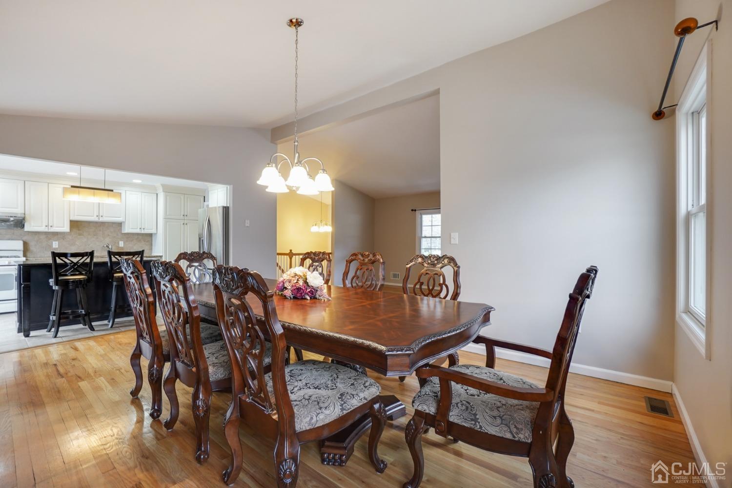 33 Wilk Road Edison, NJ 08837 - Photo 10 of 33 a view of a dining room with furniture and wooden floor