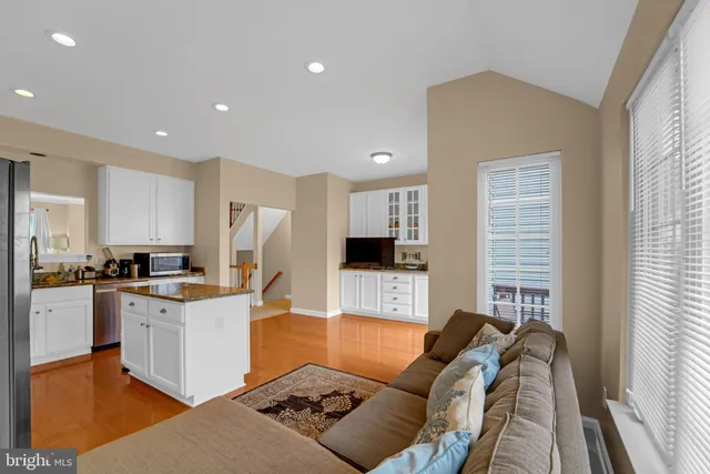 a kitchen with stainless steel appliances granite countertop a stove and a refrigerator