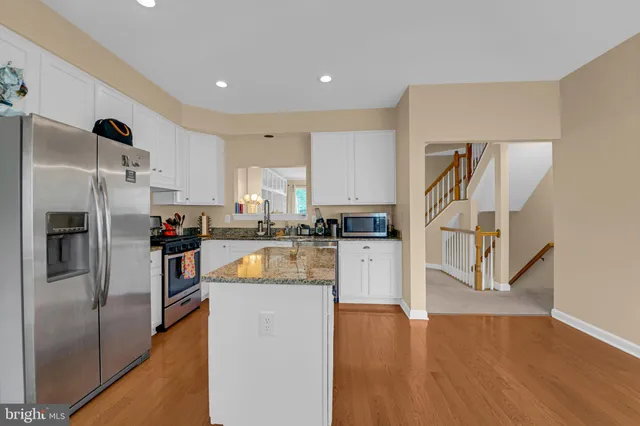 a view of a patio with a table and chairs