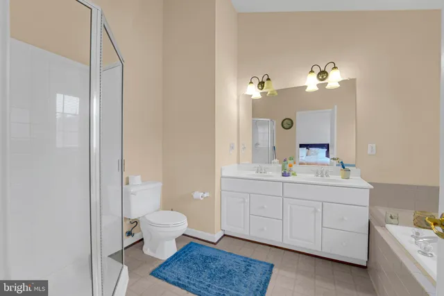 a view of a hallway with wooden floor and windows