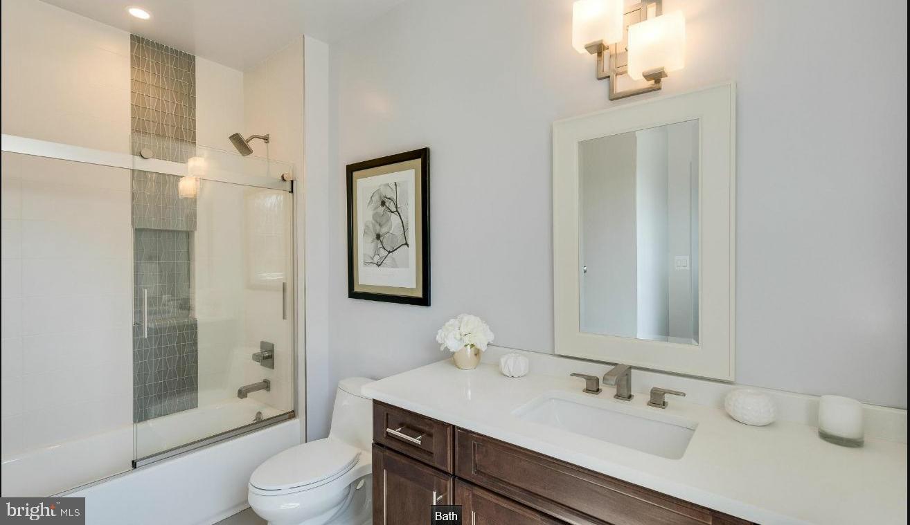 9814 Fernwood Road Bethesda, MD 20817 - Photo 27 of 31 Modern elegance in a serene bathroom.