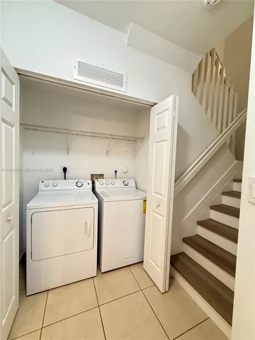 a utility room with dryer and washer
