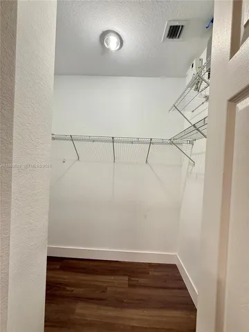 a view of a room with racks on the wall