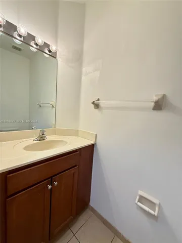 a bathroom with a sink and mirror
