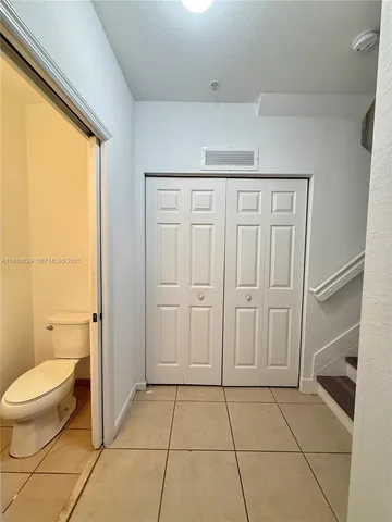 a spacious bathroom with a toilet