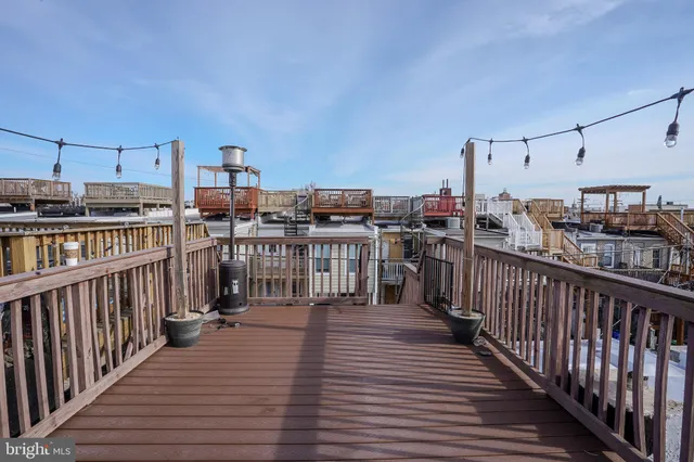 a view of a balcony with wooden floor