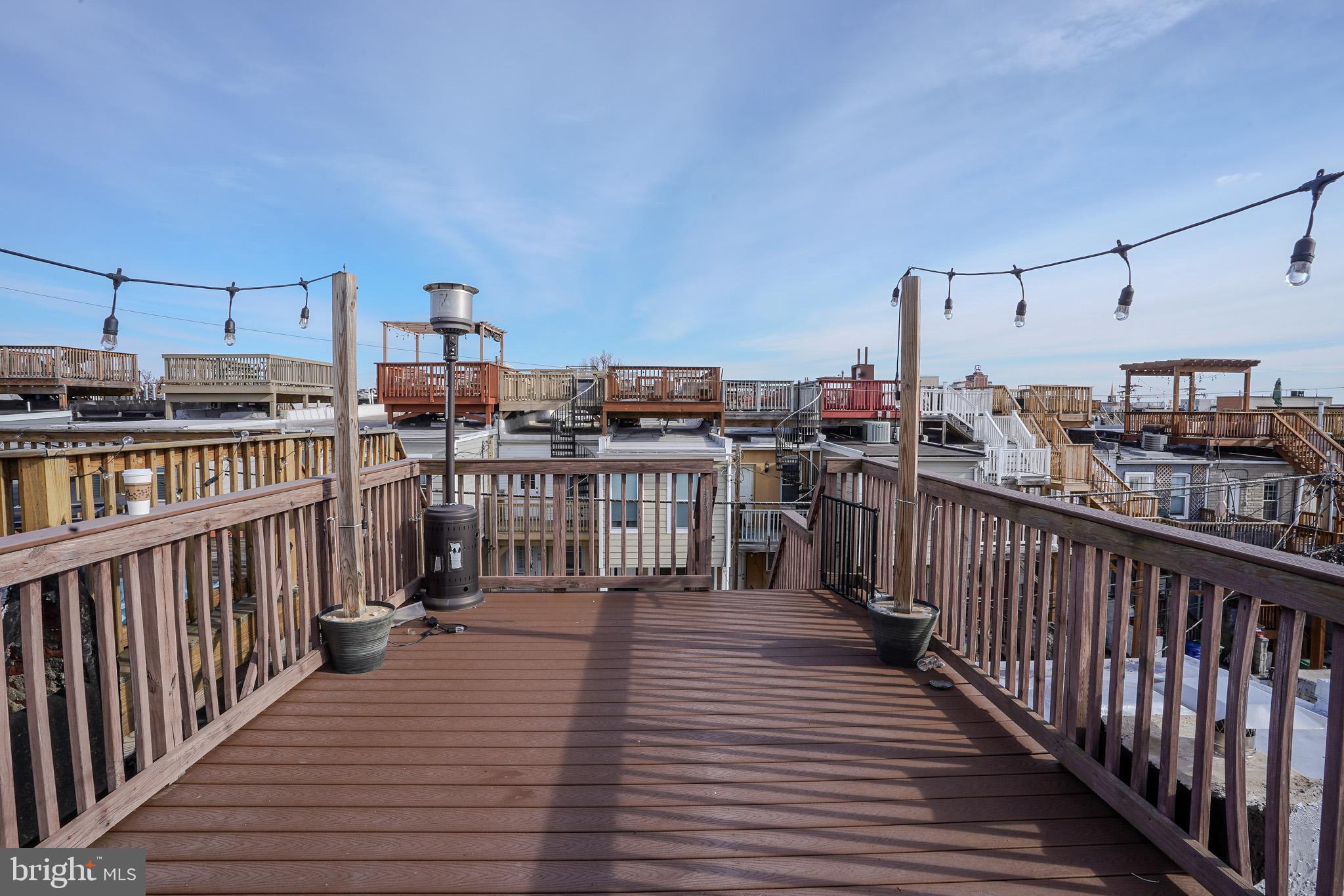 713 South Linwood Avenue Baltimore, MD 21224 - Photo 29 of 32 a view of a balcony with wooden floor
