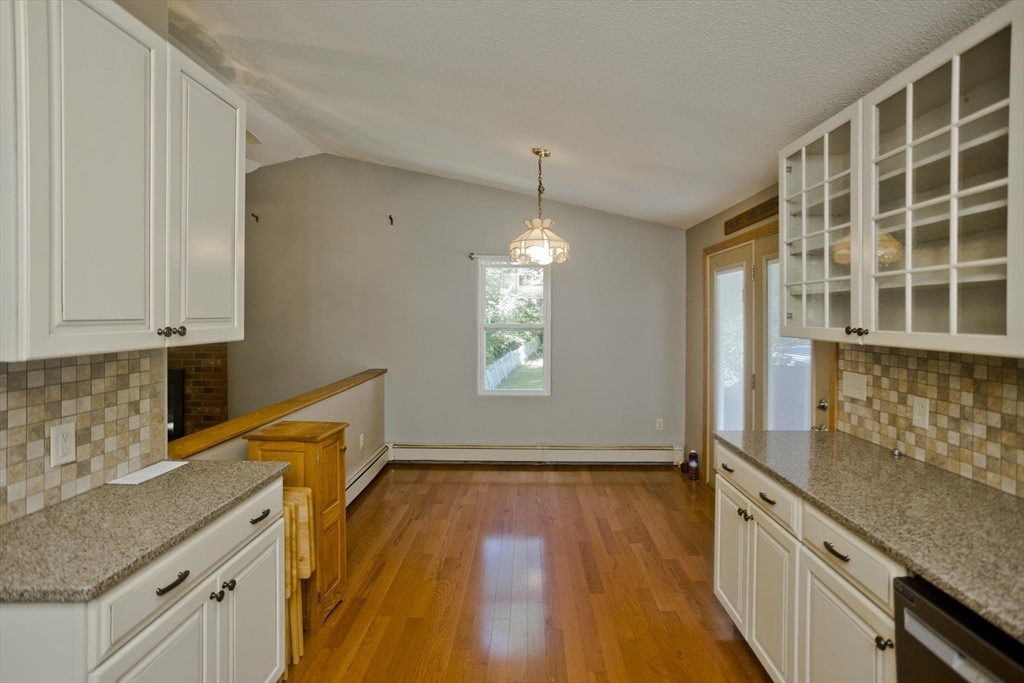 288 Fisk Road Hardwick, MA 01082 - Photo 20 of 42 a kitchen with granite countertop a sink stove and cabinets