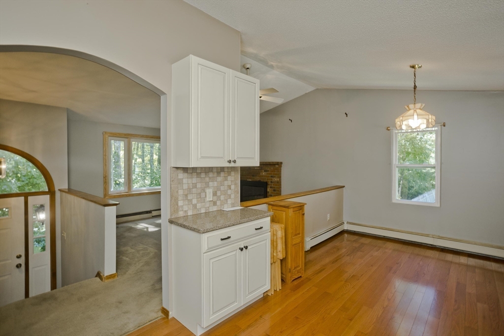 288 Fisk Road Hardwick, MA 01082 - Photo 22 of 42 a kitchen that has a lot of cabinets and wooden floor
