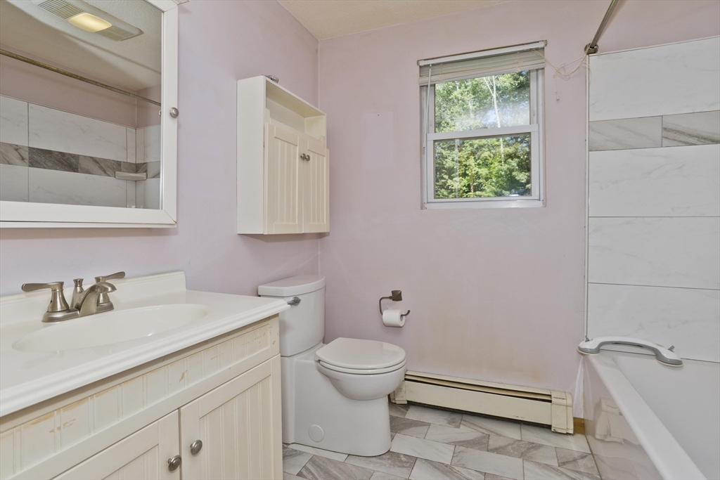 288 Fisk Road Hardwick, MA 01082 - Photo 28 of 42 a bathroom with a sink toilet and a mirror